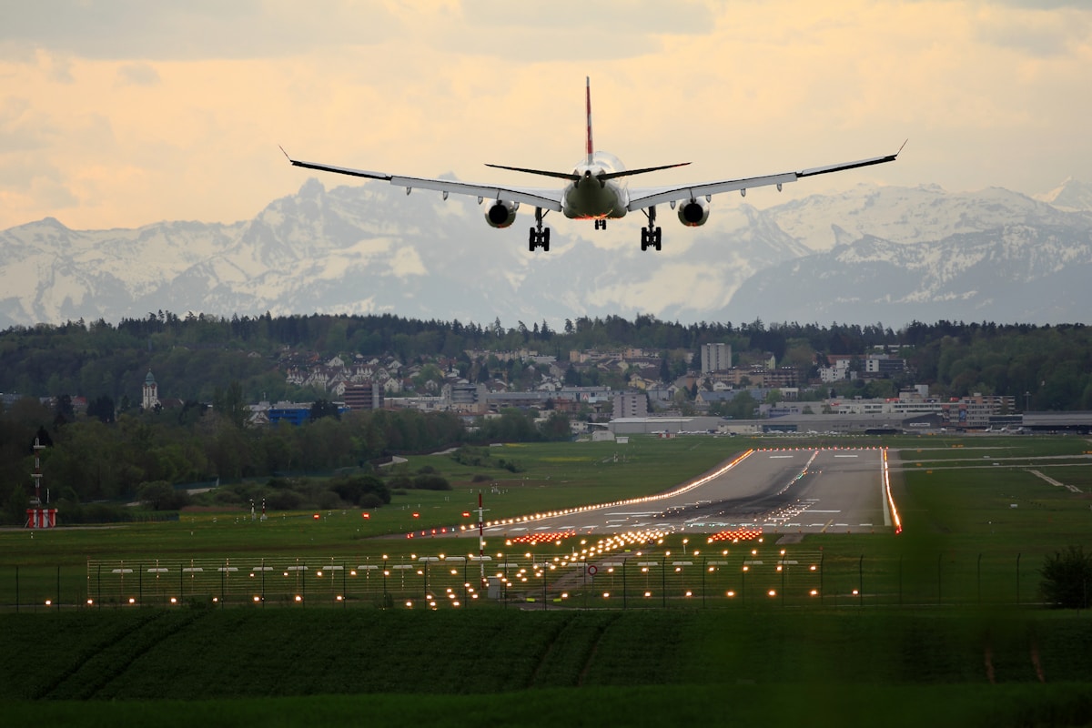 Commercial aircraft in flight at sunset